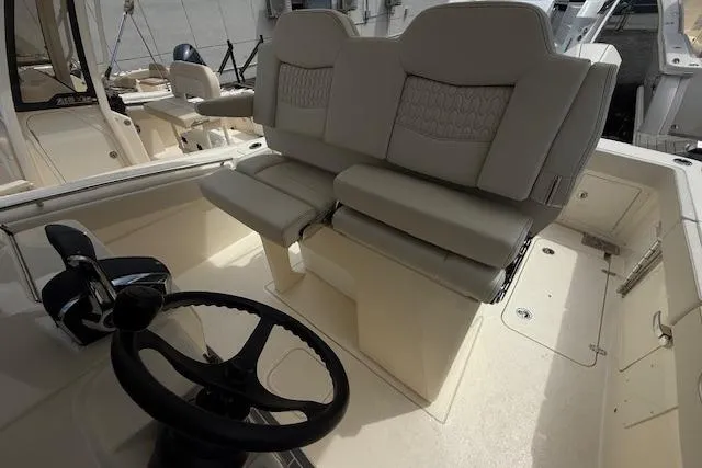  Yacht Photos Pics 2026 Scout 288 LXF boat interior with dual helm seats and steering wheel.