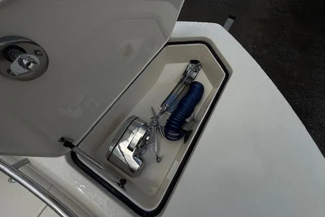  Yacht Photos Pics Open storage compartment on 2026 Scout 288 LXF boat with anchor and coiled rope.