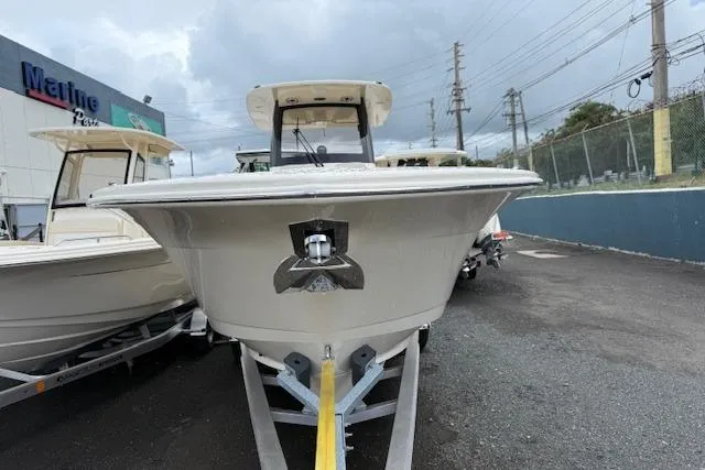  Yacht Photos Pics 2026 Scout 288 LXF boat on trailer, parked outdoors near dealership.