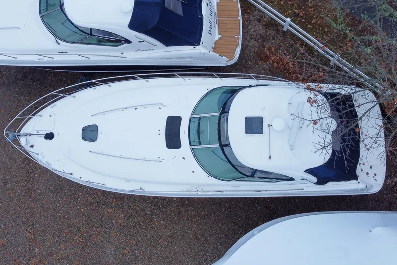  Yacht Photos Pics Aerial view of 2007 Sea Ray 40 Sundancer yacht docked among trees.