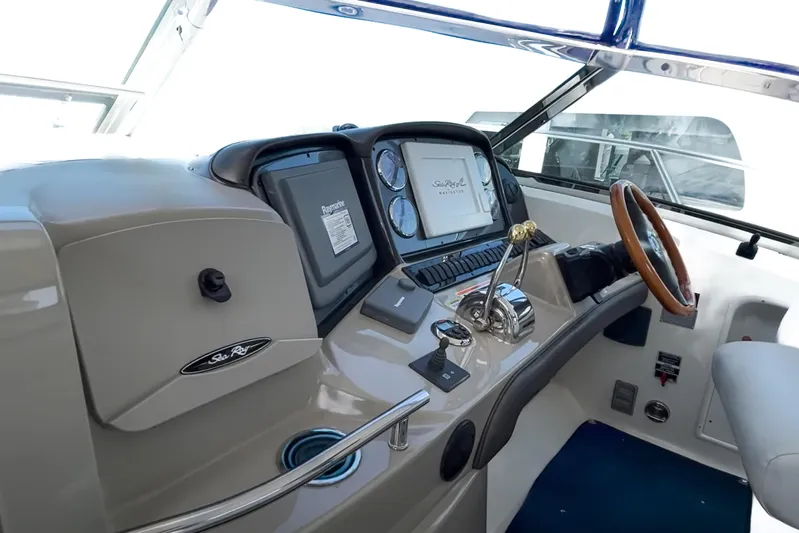  Yacht Photos Pics Helm of 2007 Sea Ray 40 Sundancer with steering wheel and navigation controls.
