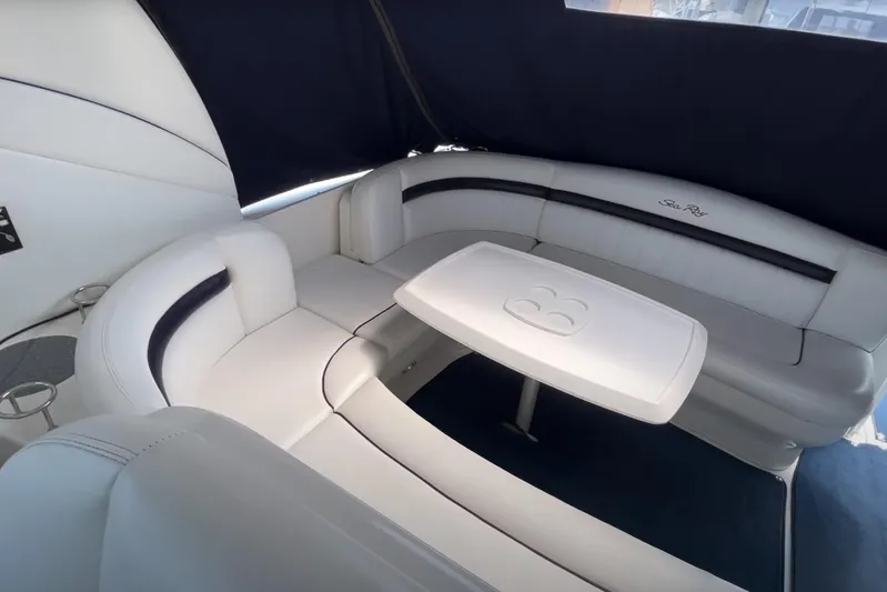  Yacht Photos Pics Luxurious 2007 Sea Ray 40 Sundancer interior with elegant white seating and table.