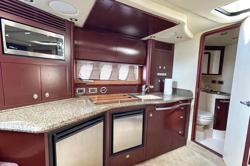  Yacht Photos Pics Luxurious 2007 Sea Ray 40 Sundancer yacht kitchen with modern amenities and elegant design.
