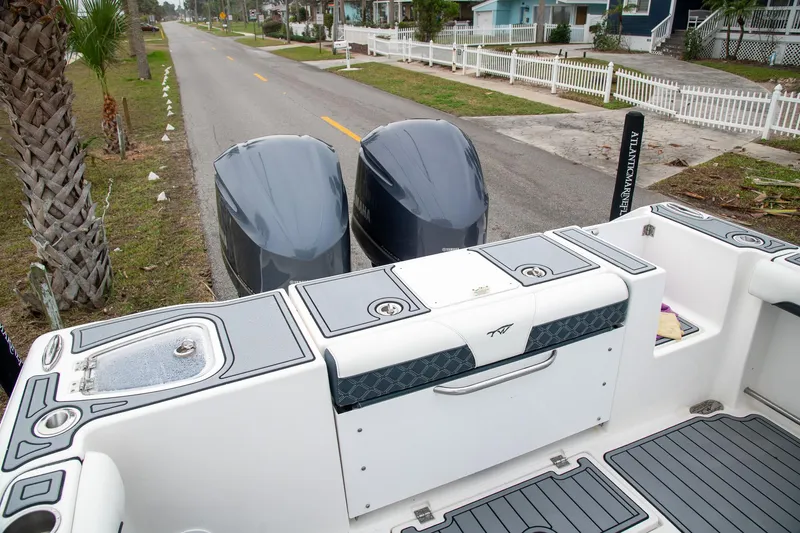  Yacht Photos Pics 2021 Tidewater 280 CC Adventure boat with dual engines on a residential street.