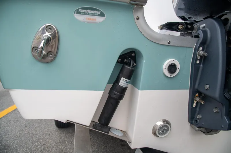  Yacht Photos Pics 2021 Tidewater 280 CC Adventure boat transom with hydraulic components and Yamaha branding.