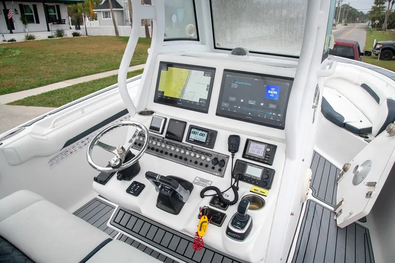  Yacht Photos Pics Cockpit of 2021 Tidewater 280 CC Adventure boat with advanced navigation and control systems.