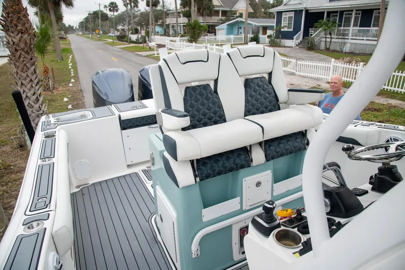  Yacht Photos Pics 2021 Tidewater 280 CC Adventure boat with dual seats and modern interior design.