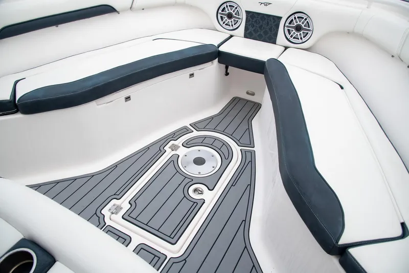  Yacht Photos Pics 2021 Tidewater 280 CC Adventure boat interior with cushioned seating and stylish flooring.