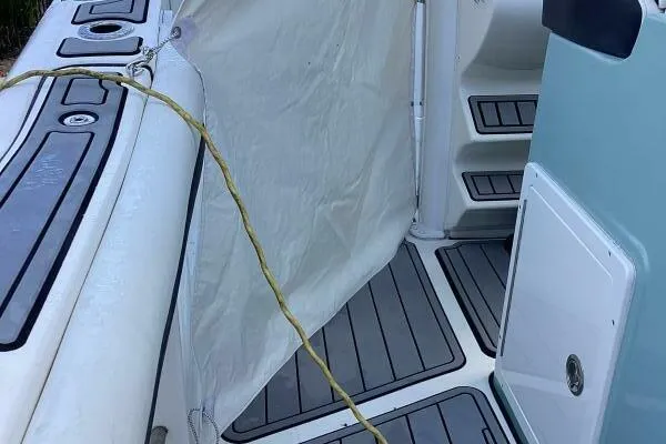  Yacht Photos Pics 2021 Tidewater 280 CC Adventure boat interior with non-slip flooring and storage compartments.