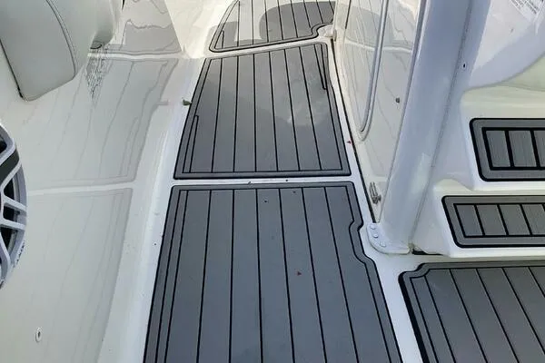  Yacht Photos Pics 2021 Tidewater 280 CC Adventure boat deck with sleek, modern gray flooring.
