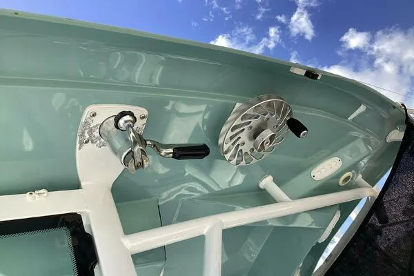  Yacht Photos Pics Tidewater 280 CC Adventure 2021 boat detail with winch and handle against blue sky.
