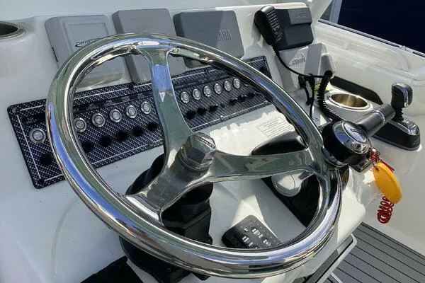  Yacht Photos Pics Steering wheel and controls of 2021 Tidewater 280 CC Adventure boat.