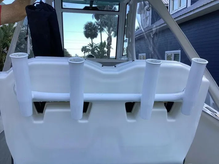  Yacht Photos Pics 2021 Tidewater 280 CC Adventure boat with rod holders and cabin view.