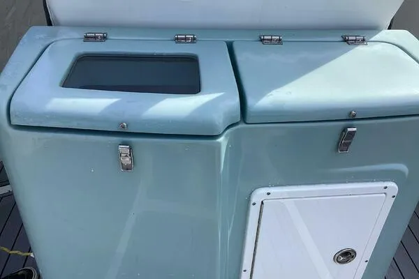  Yacht Photos Pics Tidewater 280 CC Adventure 2021 boat storage compartments with secure latches and sleek design.