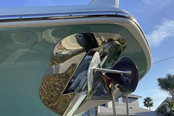  Yacht Photos Pics 2021 Tidewater 280 CC Adventure boat anchor detail with blue sky background.