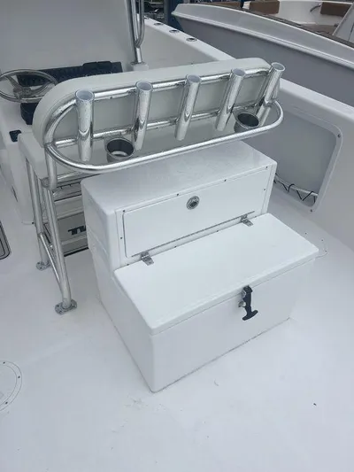  Yacht Photos Pics 2024 Twin Vee 280 STX boat with rod holders and storage compartments.