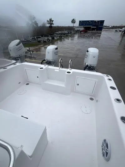  Yacht Photos Pics 2024 Twin Vee 280 STX boat with spacious deck and dual outboard motors.