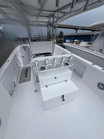  Yacht Photos Pics 2024 Twin Vee 280 STX boat interior with seating and storage.