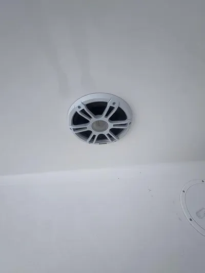  Yacht Photos Pics 2024 Twin Vee 280 STX boat speaker on white interior ceiling.