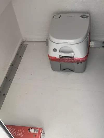  Yacht Photos Pics Portable toilet inside 2024 Twin Vee 280 STX boat cabin.