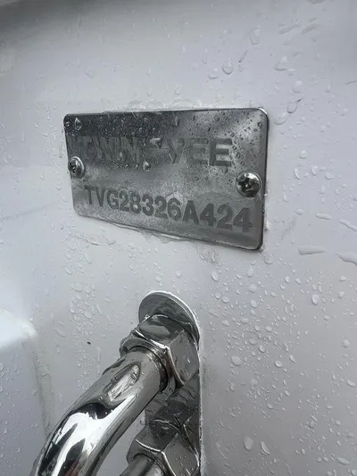  Yacht Photos Pics 2024 Twin Vee 280 STX boat identification plate with water droplets.
