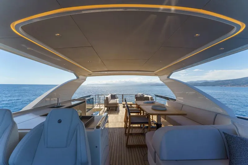  Yacht Photos Pics Luxurious 2026 Absolute 70 Fly yacht deck with elegant seating and ocean view.