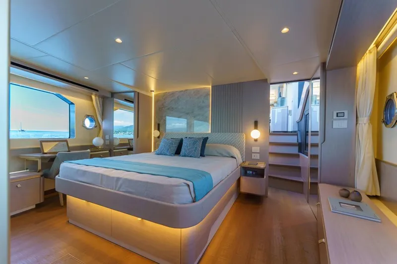  Yacht Photos Pics Luxurious bedroom interior of 2026 Absolute 70 Fly yacht with modern design and ocean view.