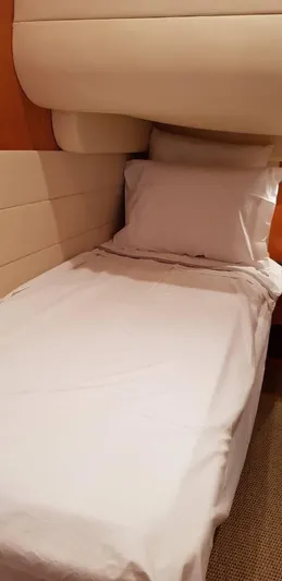  Yacht Photos Pics Single bed in 2004 Uniesse 57 yacht cabin with white linens.