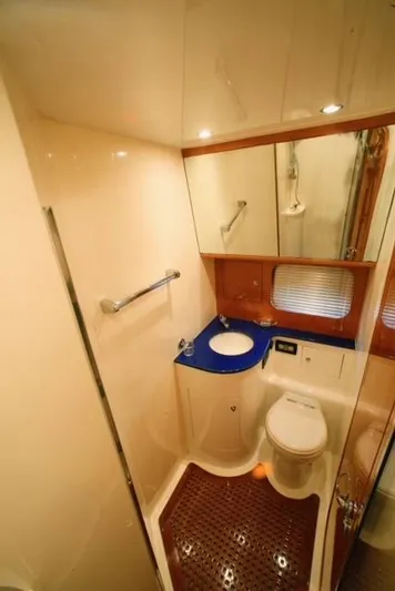  Yacht Photos Pics Luxurious bathroom in 2004 Uniesse 57 yacht with modern fixtures and elegant design.