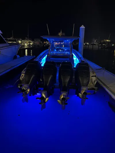  Yacht Photos Pics 2019 Nor-Tech 450 Sport boat with blue underwater lights at night.