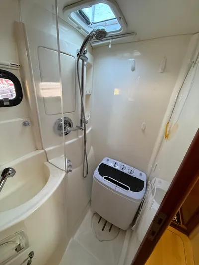 Selah Yacht Photos Pics Compact bathroom in 2010 Leopard 38 yacht with shower and washing machine.