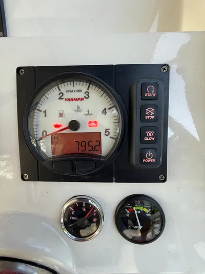 Selah Yacht Photos Pics Yanmar engine control panel on a 2010 Leopard 38, showing RPM, fuel, and voltage gauges.