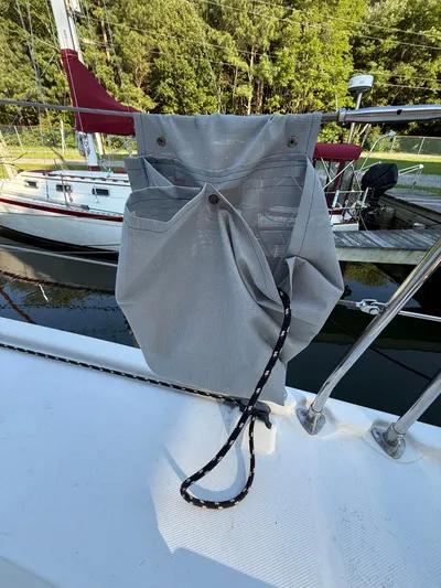 Selah Yacht Photos Pics Gray storage bag on a 2010 Leopard 38 sailboat deck, with docked boats in background.