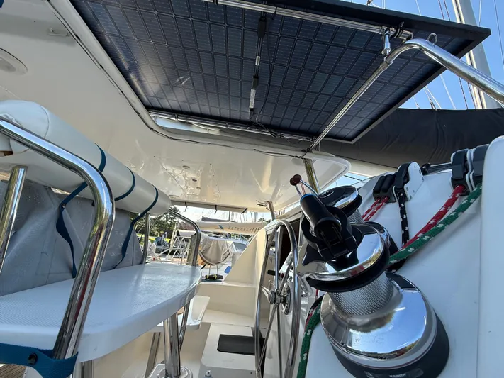 Selah Yacht Photos Pics Interior view of a 2010 Leopard 38 catamaran with solar panels and steering wheel.