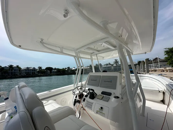  Yacht Photos Pics 2015 Intrepid 400 Center Console boat interior with helm and seating.