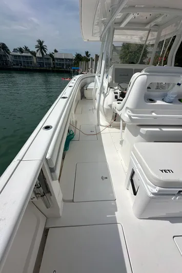  Yacht Photos Pics 2015 Intrepid 400 Center Console boat, sleek design, docked by waterfront homes.