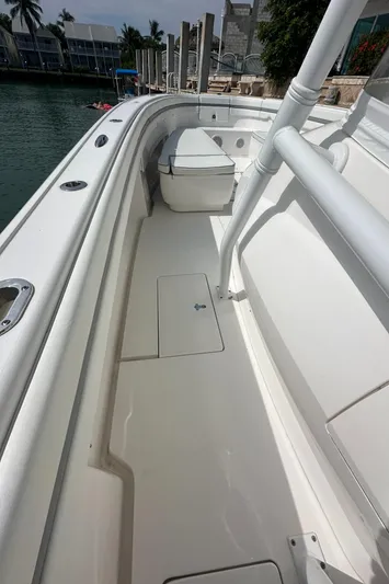  Yacht Photos Pics 2015 Intrepid 400 Center Console boat deck with seating, docked by waterfront homes.