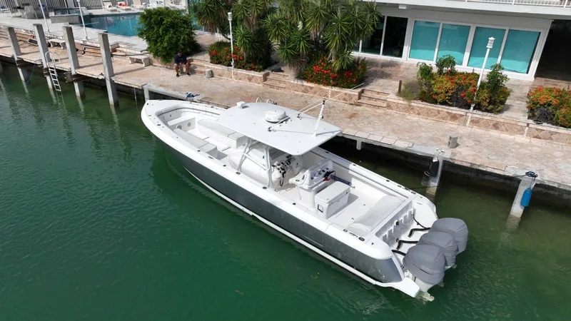  Yacht Photos Pics 2015 Intrepid 400 Center Console boat docked by waterfront property.