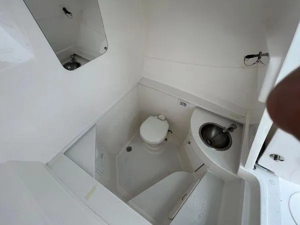  Yacht Photos Pics 2015 Intrepid 400 Center Console boat bathroom with toilet and sink.