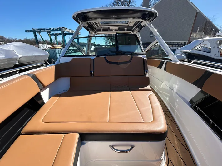  Yacht Photos Pics 2023 Chaparral 300 OSX boat interior with tan seating and sleek design.