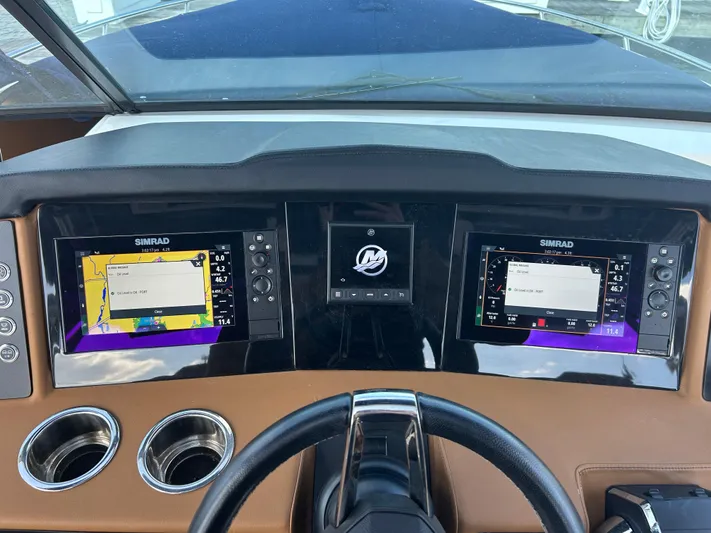  Yacht Photos Pics 2023 Chaparral 300 OSX dashboard with dual Simrad displays and steering wheel.