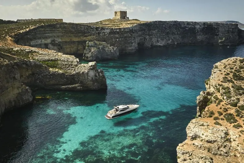  Yacht Photos Pics Luxury Sunseeker Predator 64 yacht in a stunning coastal cove, 2010 model.