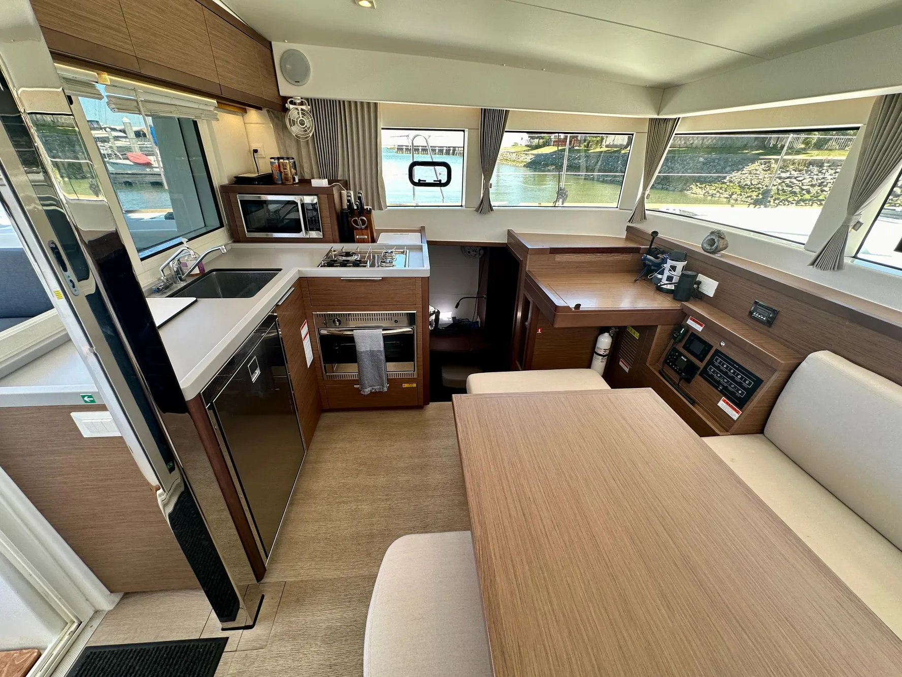 Interior of 2020 Lagoon 40 catamaran with modern kitchen and dining area.