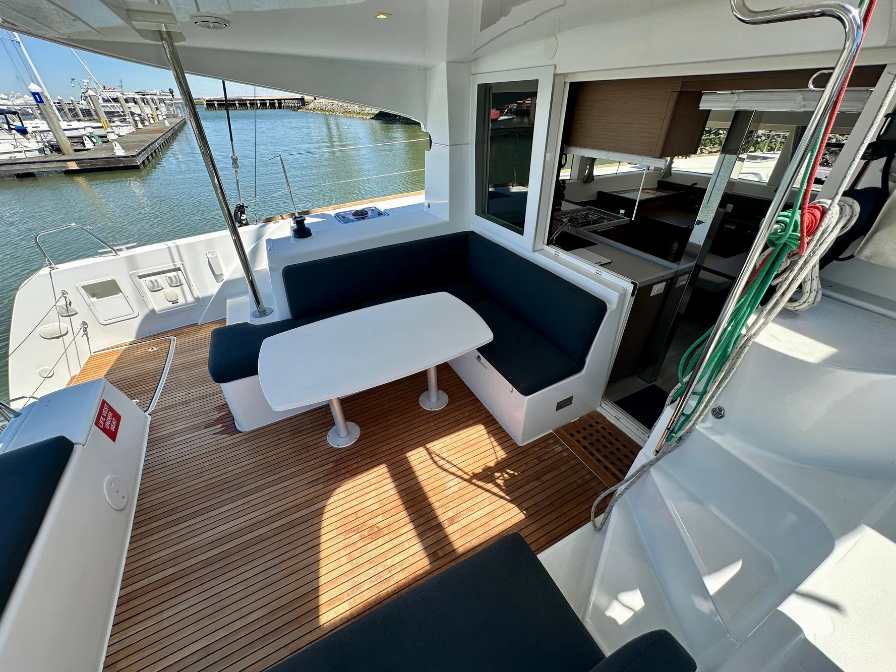 2020 Lagoon 40 catamaran with spacious outdoor seating and dining area at the marina.
