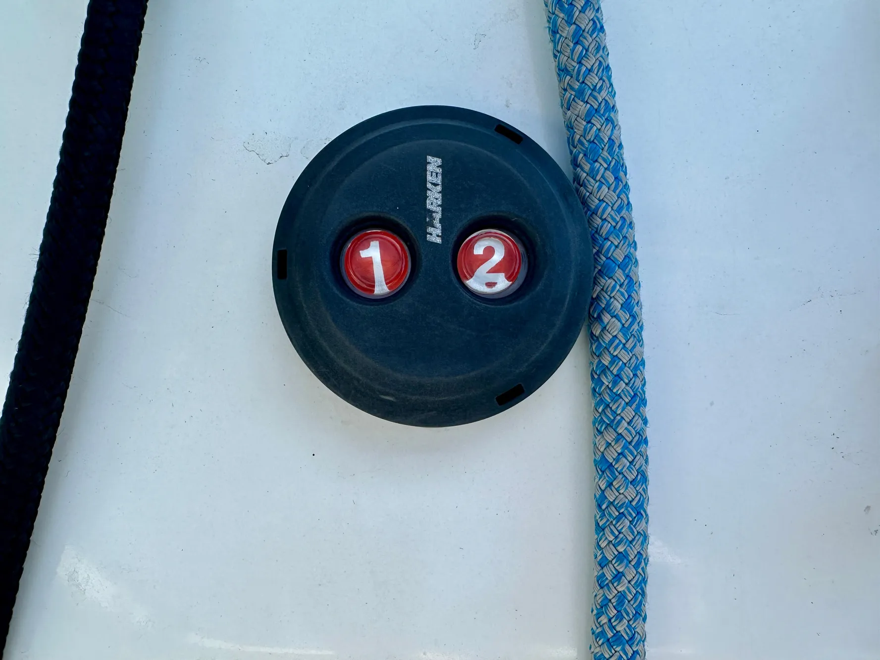 Battery switch on 2020 Lagoon 40 catamaran with ropes nearby.