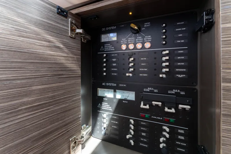 La Dolce Vita Yacht Photos Pics Electrical control panel inside 2020 Tiara Yachts 38 LS, showcasing DC and AC systems.
