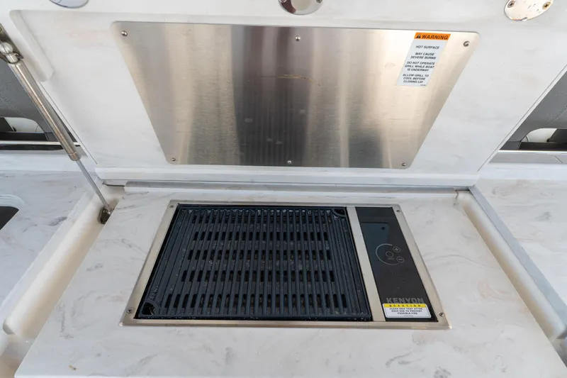 La Dolce Vita Yacht Photos Pics Outdoor grill on 2020 Tiara Yachts 38 LS, featuring Kenyon electric cooktop.