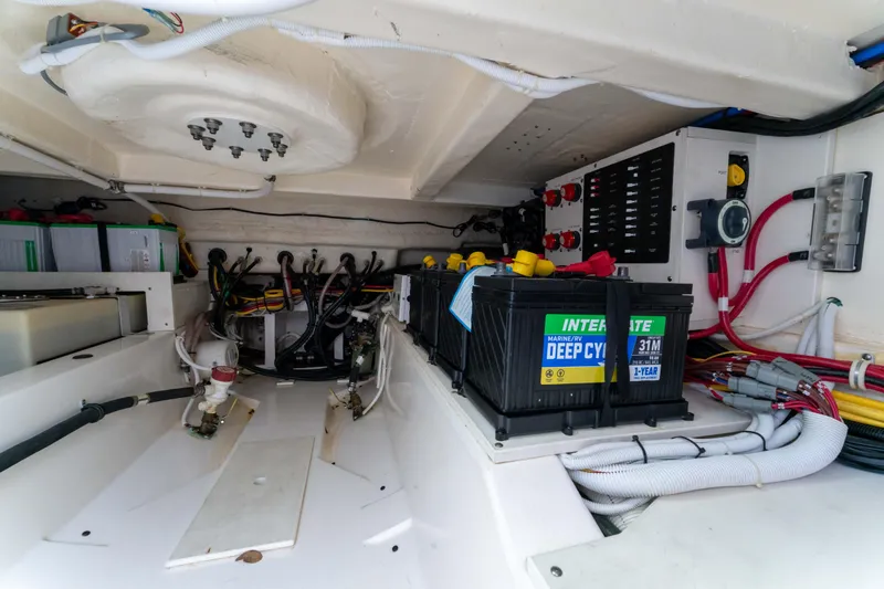 La Dolce Vita Yacht Photos Pics Engine compartment of 2020 Tiara Yachts 38 LS, featuring batteries and wiring systems.