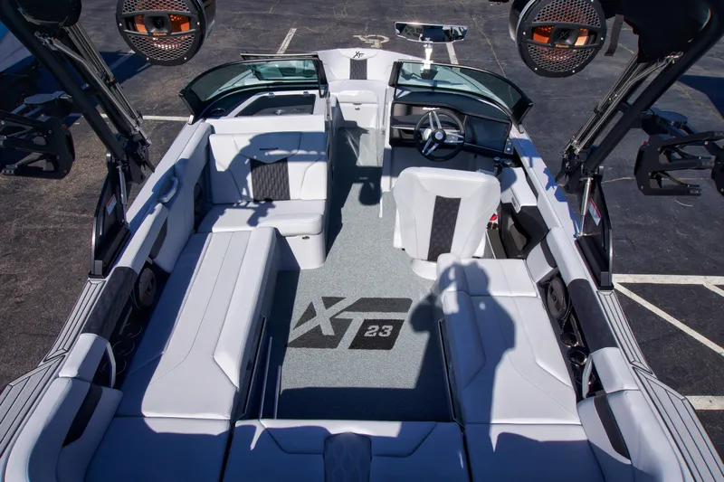  Yacht Photos Pics 2025 MasterCraft XT23 boat interior with sleek seating and advanced audio system.