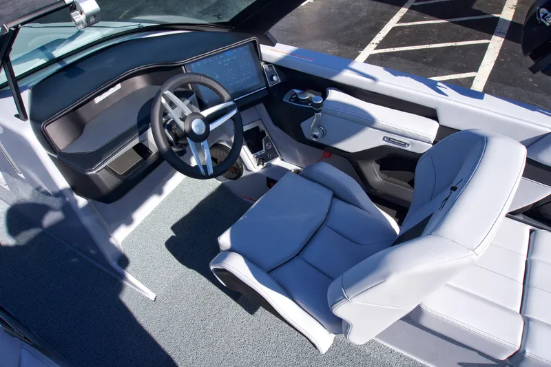  Yacht Photos Pics 2025 MasterCraft XT23 boat interior with modern dashboard and comfortable seating.